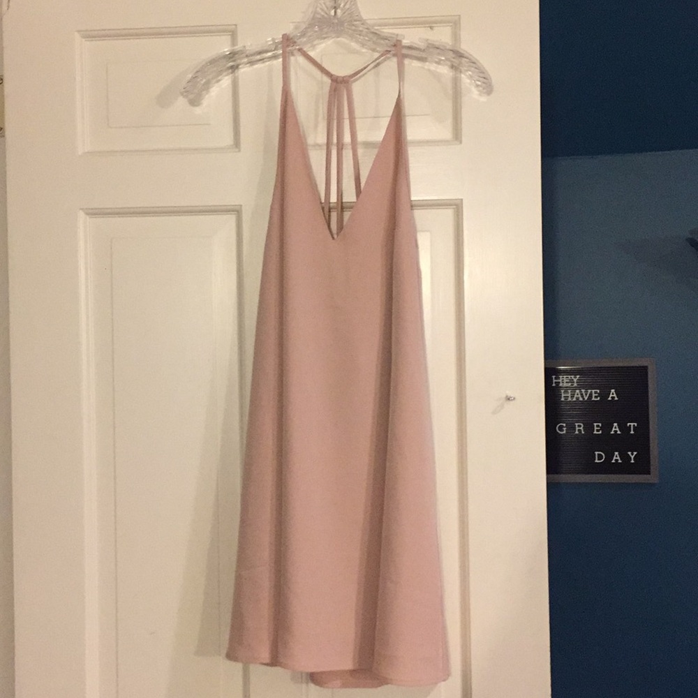 Nude shift dress with a strappy, open back